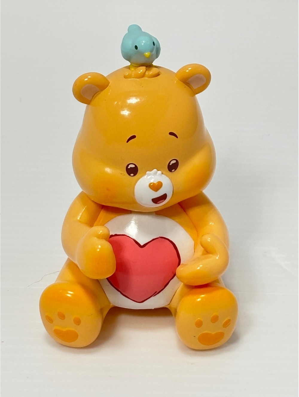 Care Bears Baby Figurine with Blue Bird on Head, Yellow Bear Holding Red Heart